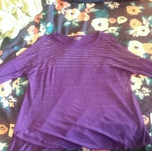 A purple sparkly long sleeve shirt